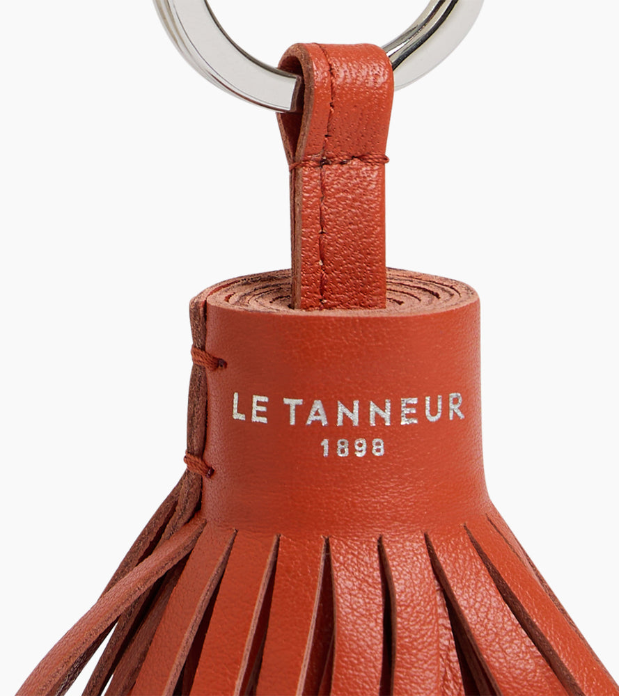 Porte clés pompons en cuir lisse